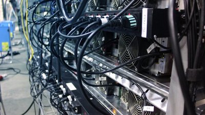 A well-organized mining farm showcasing rows of powerful mining rigs