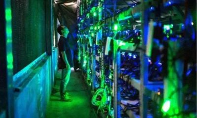 A modern mining farm showcasing rows of high-performance mining rigs.